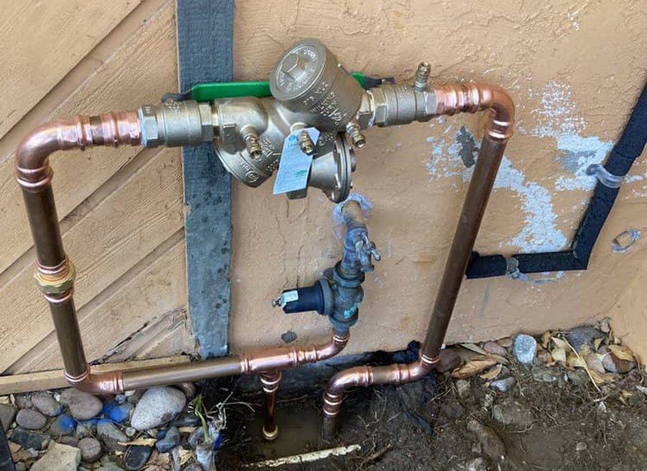 Broken backflow assembly needing service